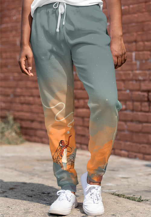 GDBee Art joggers with illustrated woman, cloud design, worn outdoors by person in white sneakers